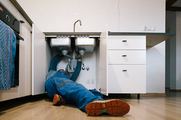 Professional Emergency Plumber technician working in Hartselle, AL